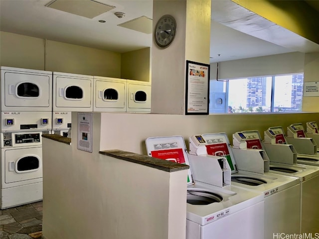 laundry area featuring stacked washer / dryer and separate washer and dryer