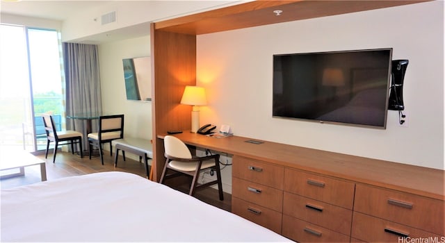 bedroom featuring access to outside and light hardwood / wood-style flooring