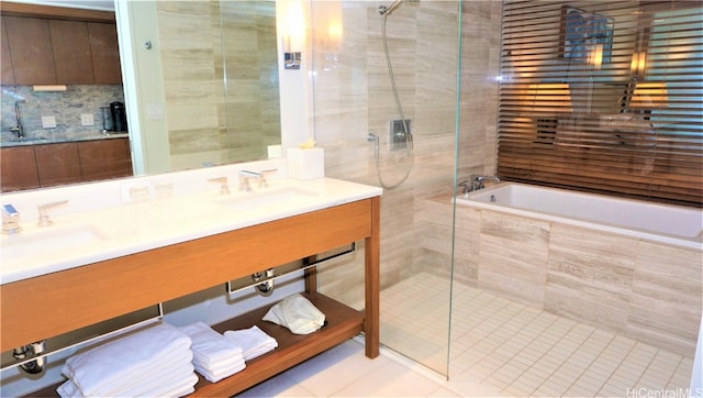 bathroom featuring vanity, decorative backsplash, separate shower and tub, and tile patterned flooring