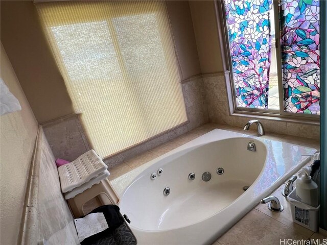 bathroom with a tub to relax in