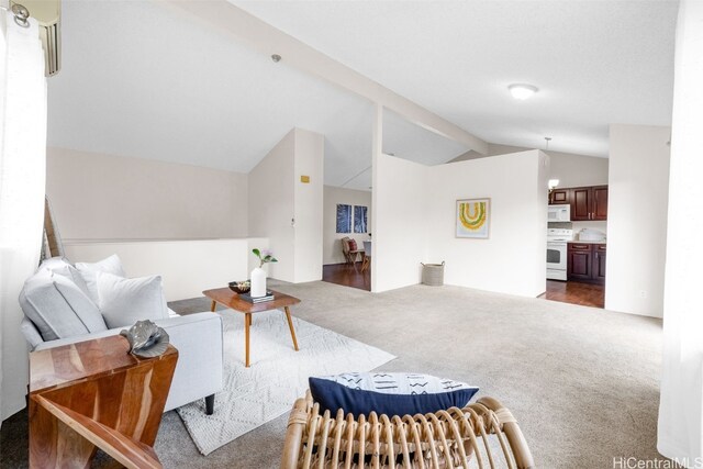 carpeted living room featuring lofted ceiling with beams