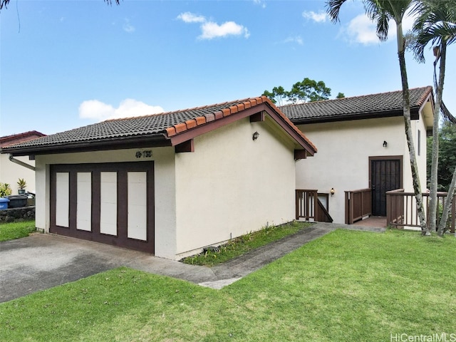 view of home's exterior with a lawn