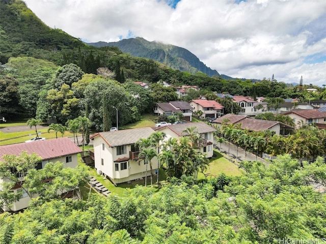 birds eye view of property with a mountain view