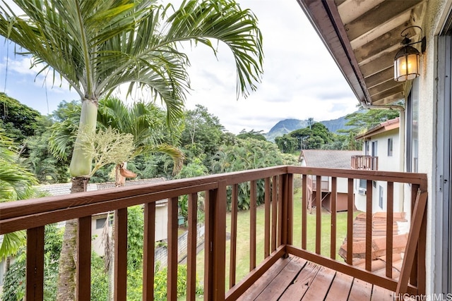 wooden deck with a mountain view