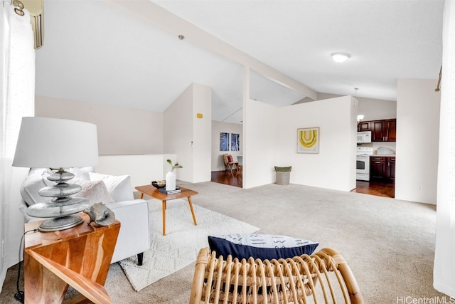 carpeted living room featuring lofted ceiling with beams