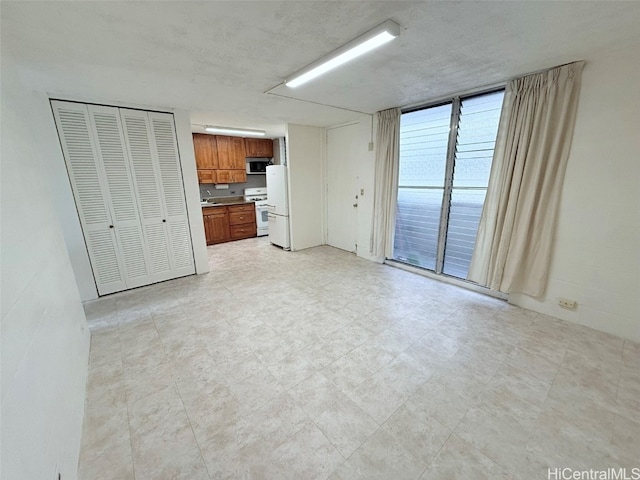 unfurnished living room with sink