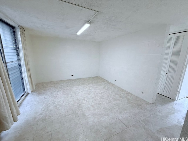 empty room with a textured ceiling