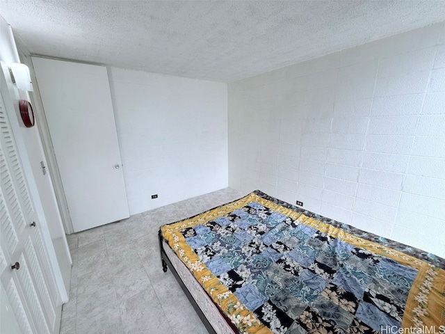 unfurnished bedroom featuring a textured ceiling