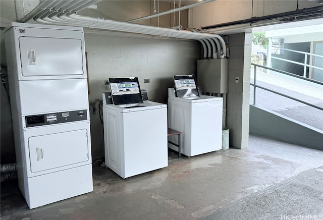 washroom featuring washer and dryer, stacked washer / drying machine, and gas water heater