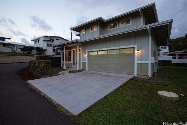 view of front of house featuring a front lawn and a garage