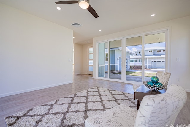 unfurnished living room with light hardwood / wood-style floors and ceiling fan