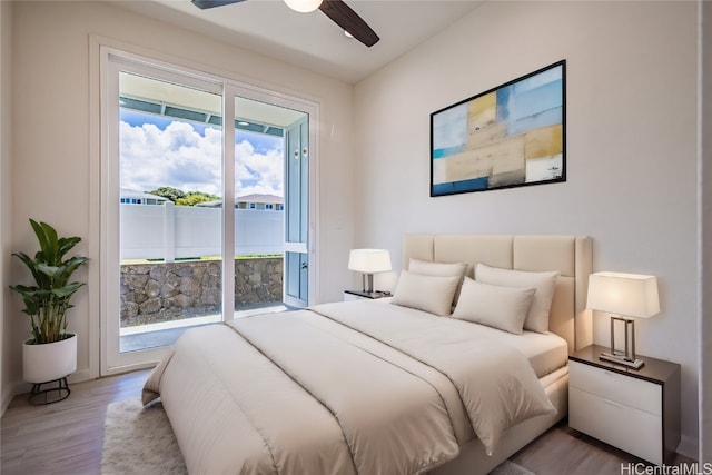 bedroom with ceiling fan, access to outside, and light wood-type flooring