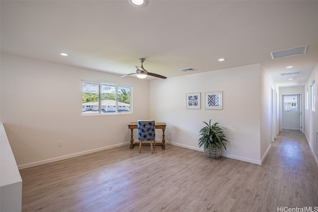 unfurnished room featuring light hardwood / wood-style flooring and ceiling fan