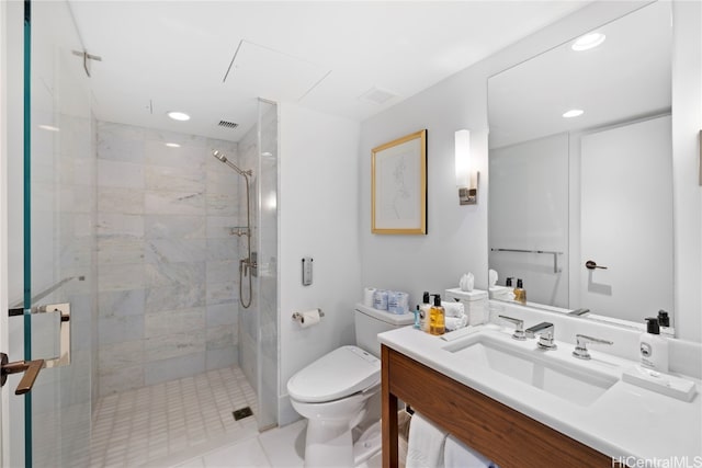 bathroom featuring vanity, toilet, a shower with shower door, and tile patterned flooring