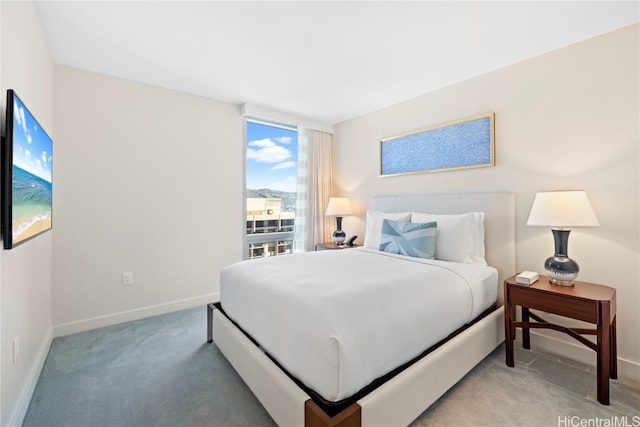 bedroom featuring light colored carpet