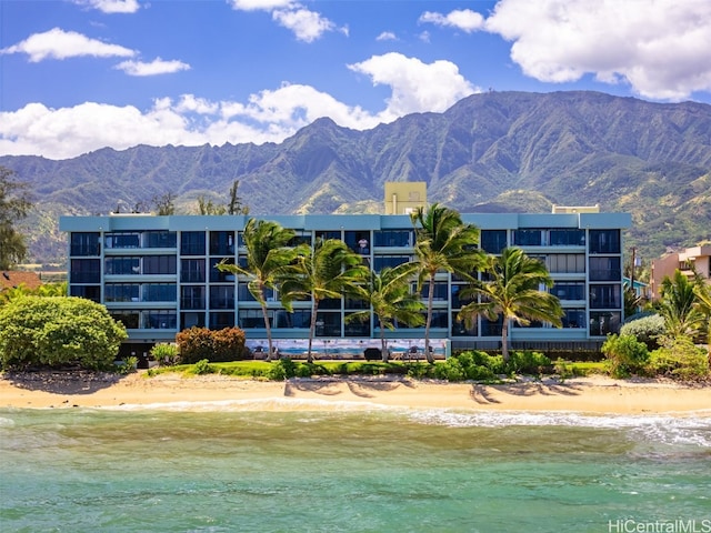 exterior space with a mountain view and a beach view