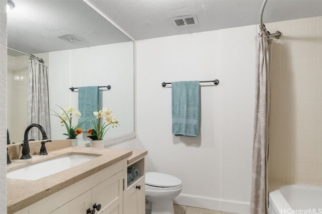 full bathroom with tile patterned floors, shower / bath combination with curtain, a textured ceiling, toilet, and vanity