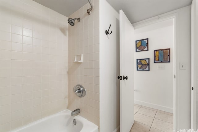 bathroom with tile patterned flooring and tiled shower / bath