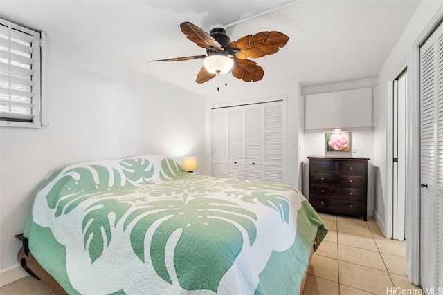 bedroom featuring light tile patterned floors and ceiling fan