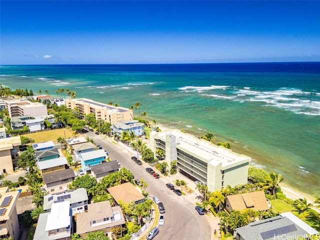 birds eye view of property featuring a water view and a view of the beach