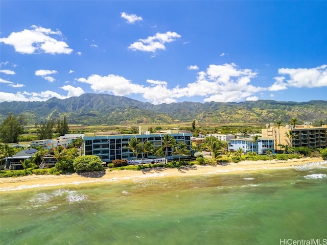 drone / aerial view with a water and mountain view