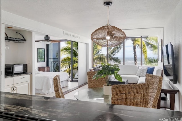 dining area featuring a textured ceiling