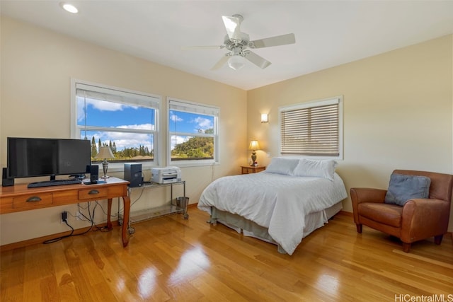 bedroom with light wood-style floors, a desk, ceiling fan, and recessed lighting