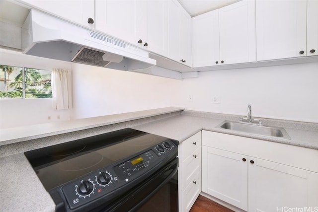 kitchen with sink, black electric range oven, white cabinets, and dark hardwood / wood-style floors