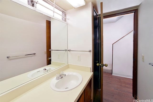 bathroom featuring vanity and wood-type flooring