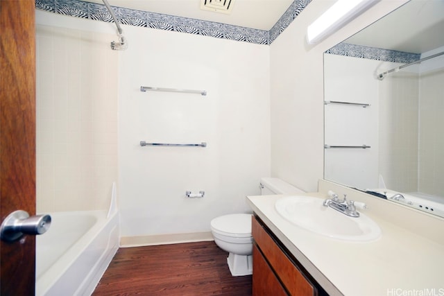 full bathroom with vanity, toilet, bathing tub / shower combination, and hardwood / wood-style floors