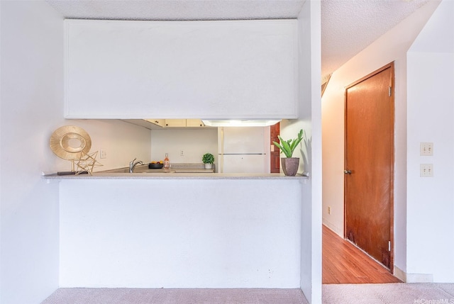 350 Aoloa St Unit A236, Kailua, HI 96734 - bar area featuring freestanding refrigerator, carpet floors, baseboards, and a sink