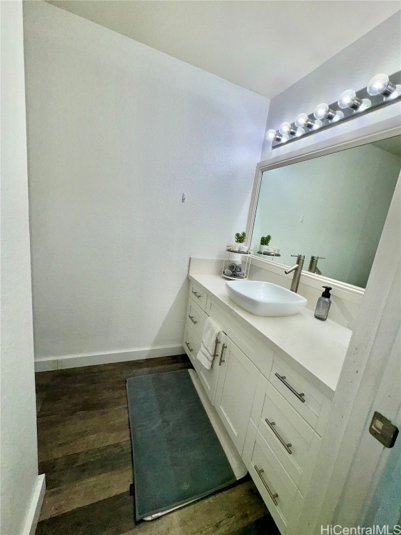 bathroom featuring vanity and hardwood / wood-style flooring