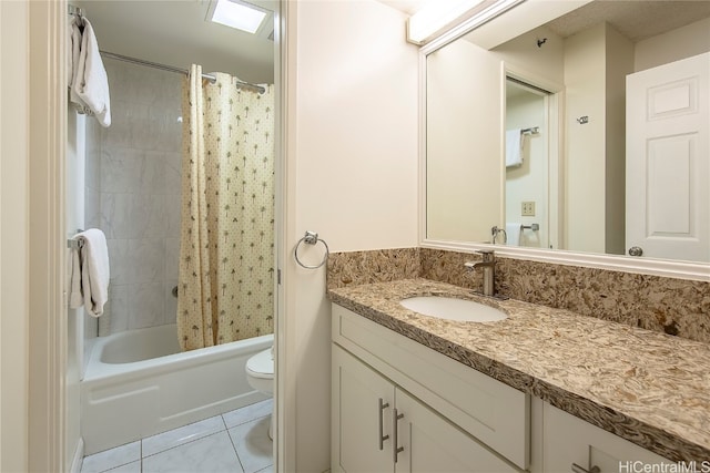 full bathroom with toilet, shower / bath combo with shower curtain, vanity, and tile patterned flooring