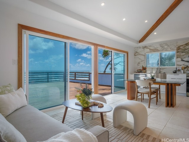 tiled living room featuring lofted ceiling with beams