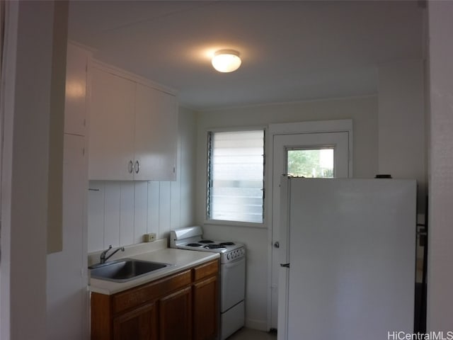 kitchen featuring sink and white appliances