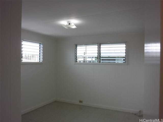 unfurnished room featuring a wealth of natural light