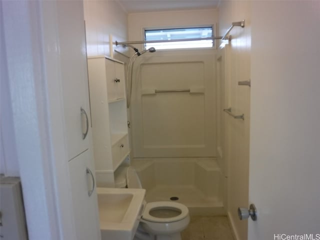 bathroom featuring vanity, a shower, toilet, and tile patterned flooring