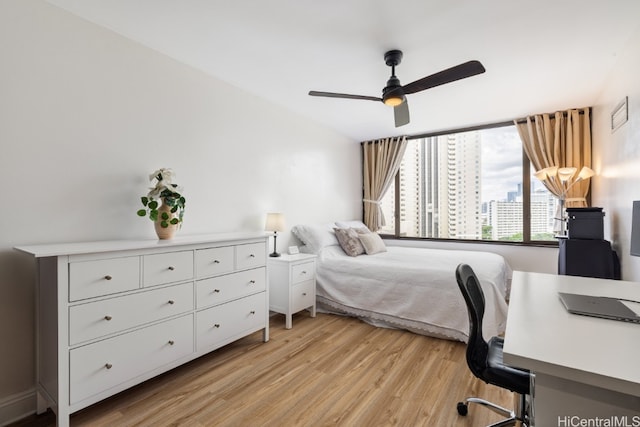 bedroom featuring light hardwood / wood-style floors and ceiling fan