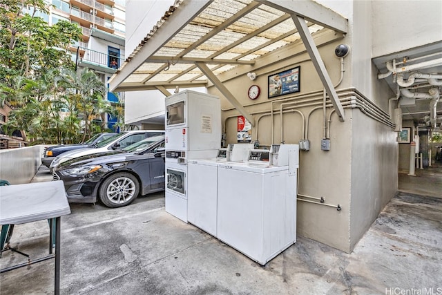 exterior space with stacked washer / drying machine and independent washer and dryer