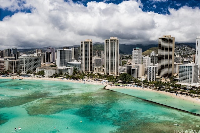 view of city featuring a water view and a view of the beach