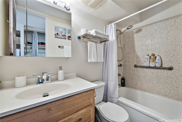 full bathroom with toilet, shower / bath combination with curtain, and vanity