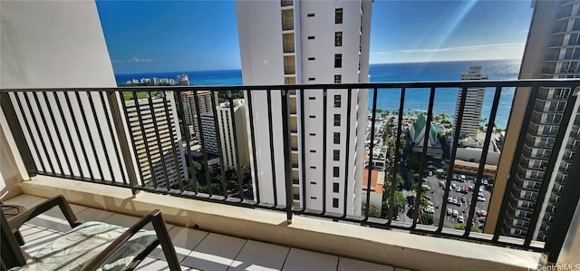 balcony featuring a water view