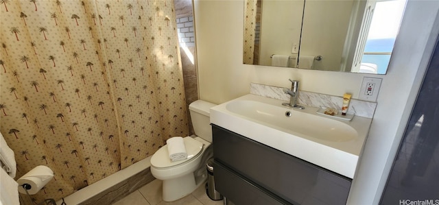 bathroom featuring vanity, toilet, a shower, and tile patterned flooring