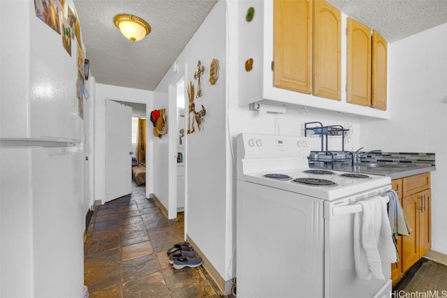 kitchen with white appliances, light brown cabinetry, a textured ceiling, and sink