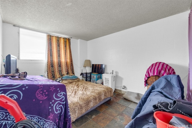 bedroom featuring a textured ceiling