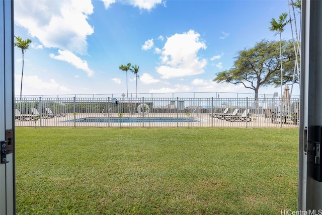 view of yard featuring a community pool