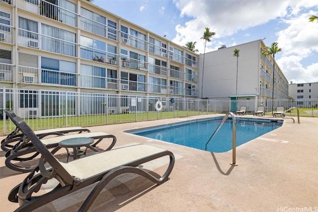 view of swimming pool featuring a patio area