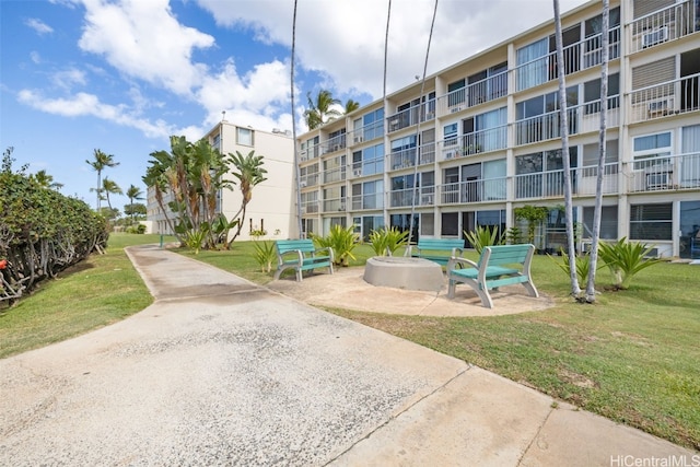 view of property's community with a lawn