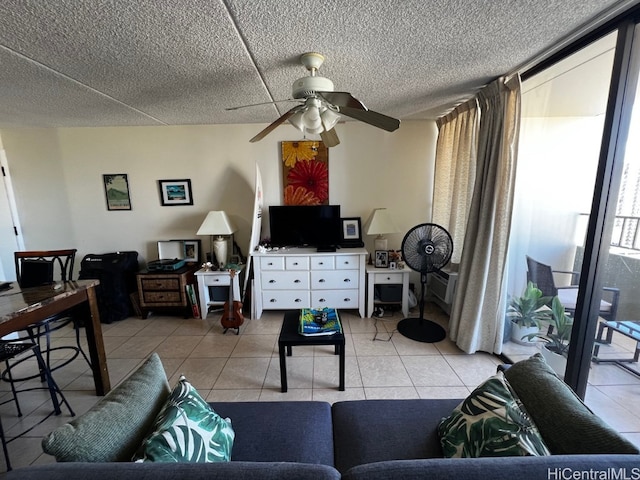 tiled living room with a textured ceiling and ceiling fan