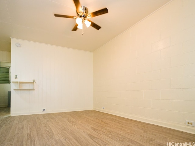 empty room with light hardwood / wood-style flooring and ceiling fan